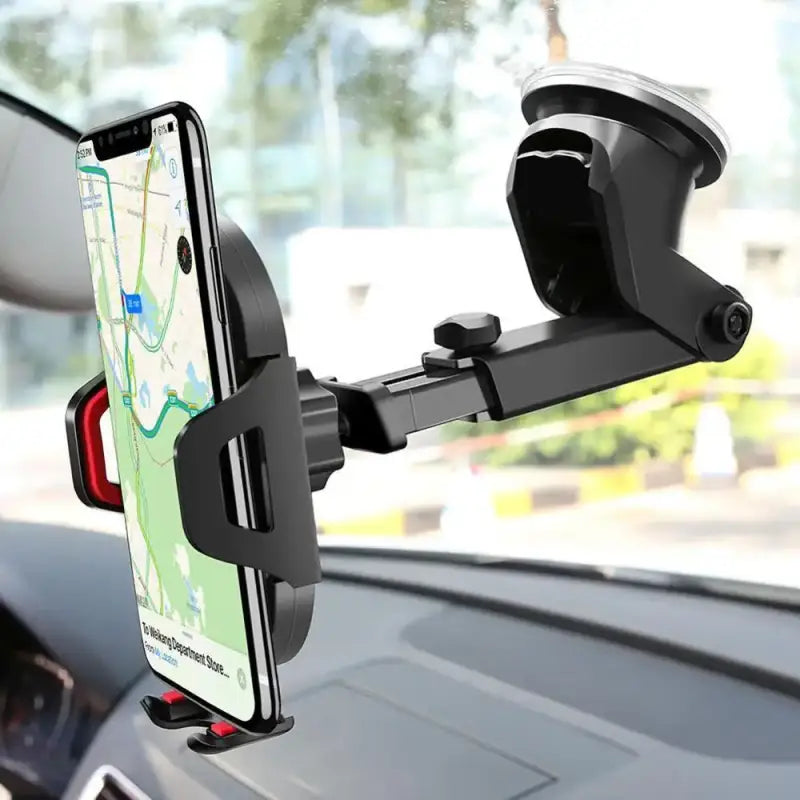 Car phone holder with smartphone displaying a map app, mounted on a car dashboard.