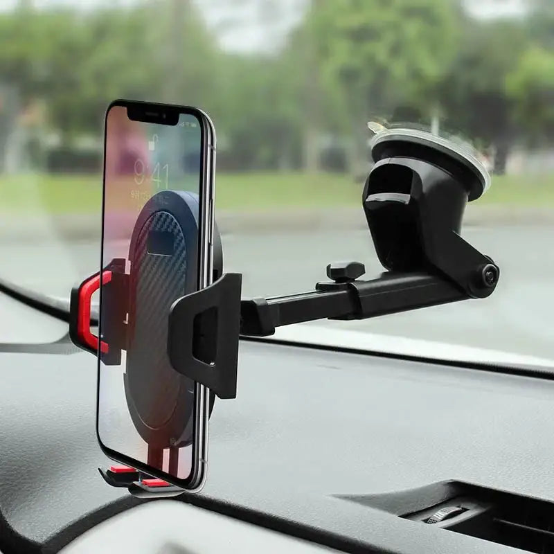 Phone holder on a car dashboard with a blurred outdoor background