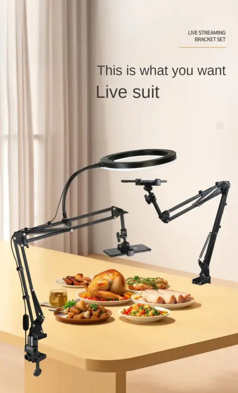 Live streaming bracket set on a table with food, against a neutral background.