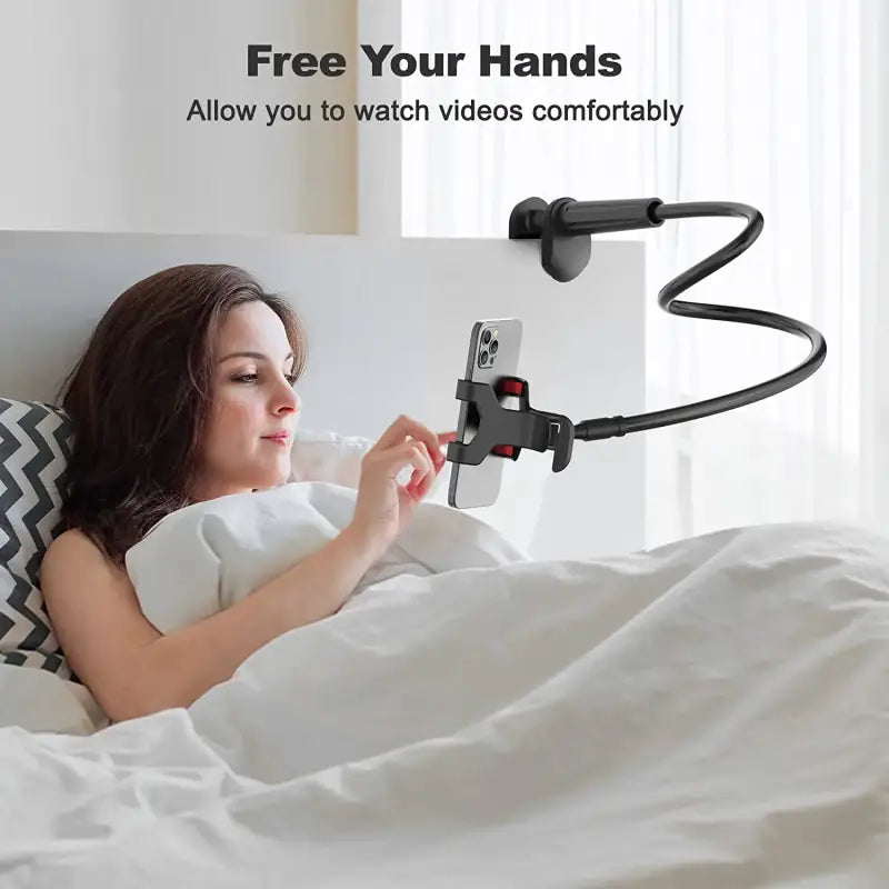 Woman lying in bed using a smartphone holder with text 'Free Your Hands' and 'Allow you to watch videos comfortably'.