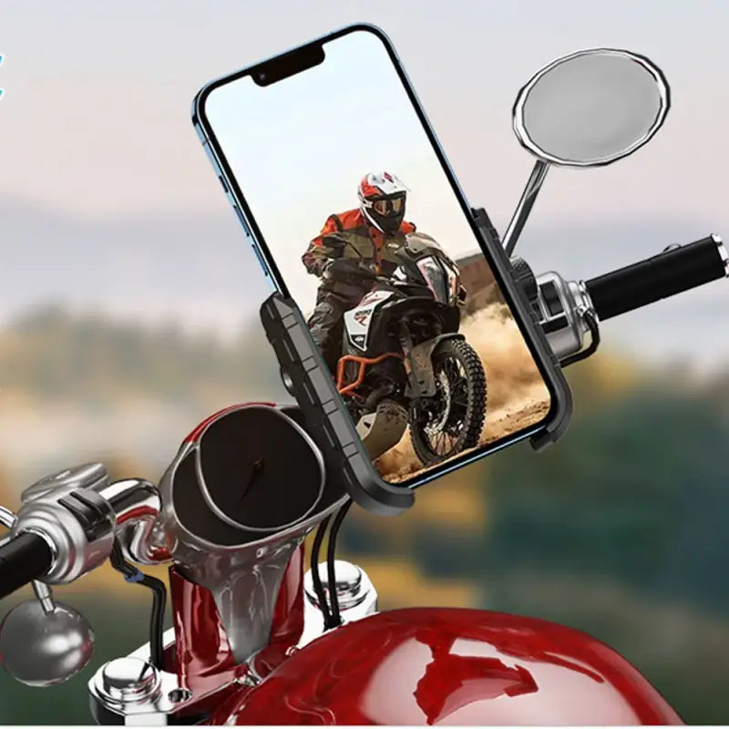 Phone mounted on a motorcycle handlebar with a scenic background