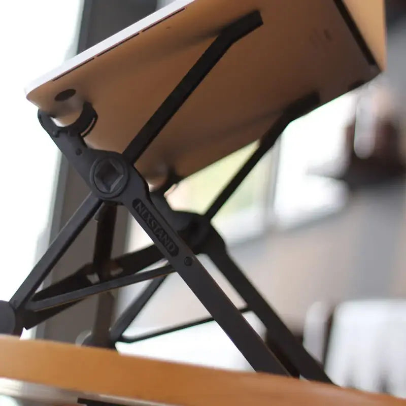 NEXSTAND K2 Laptop Stand - Compact folded position showing ultra-portability