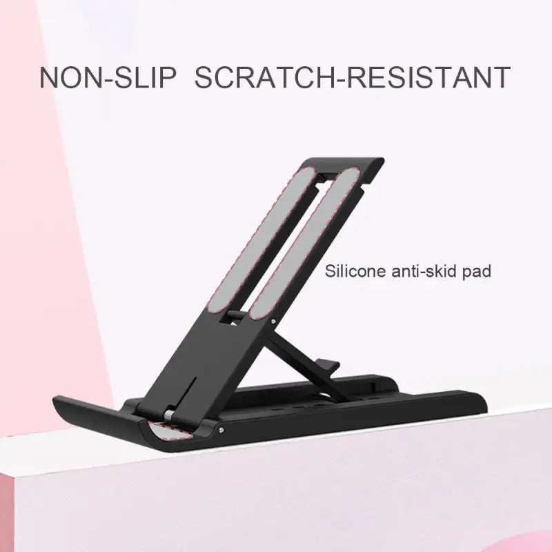 Black adjustable laptop stand on a white surface with text 'NON-SLIP SCRATCH-RESISTANT' and 'Silicone anti-skid pad'.