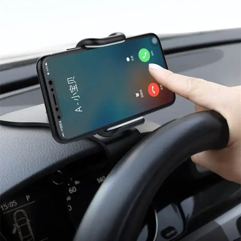 Phone mounted on a car dashboard with a hand interacting with the screen